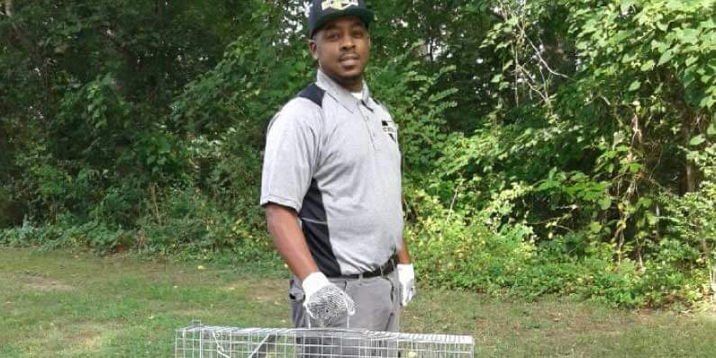 Close up of Nest Pest Control owner, James, holding animal trap
